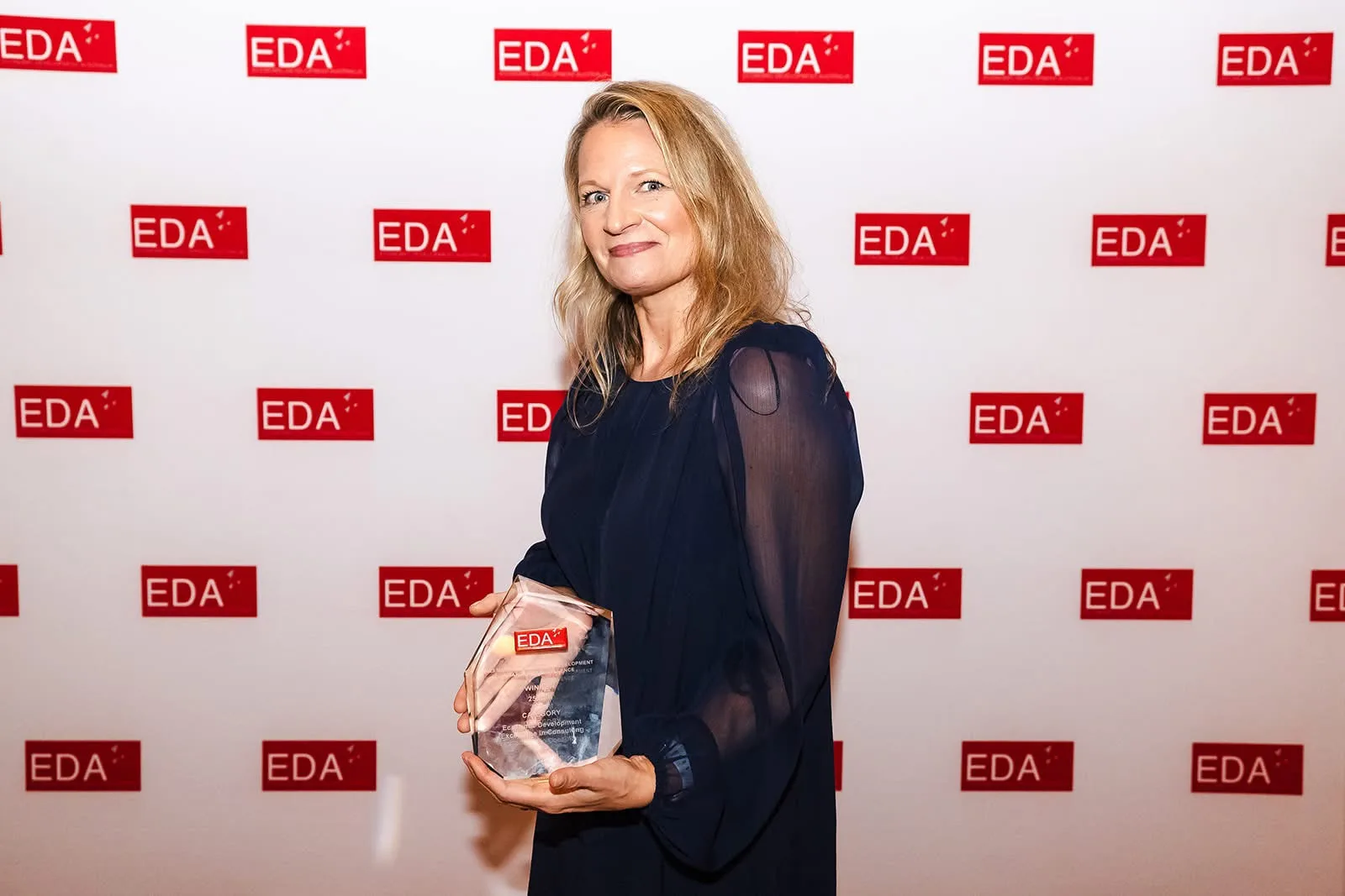Samantha Hurley collecting the Economic Development Excellence in Consulting award at the 2025 Economic Development Australia National Awards for Excellence